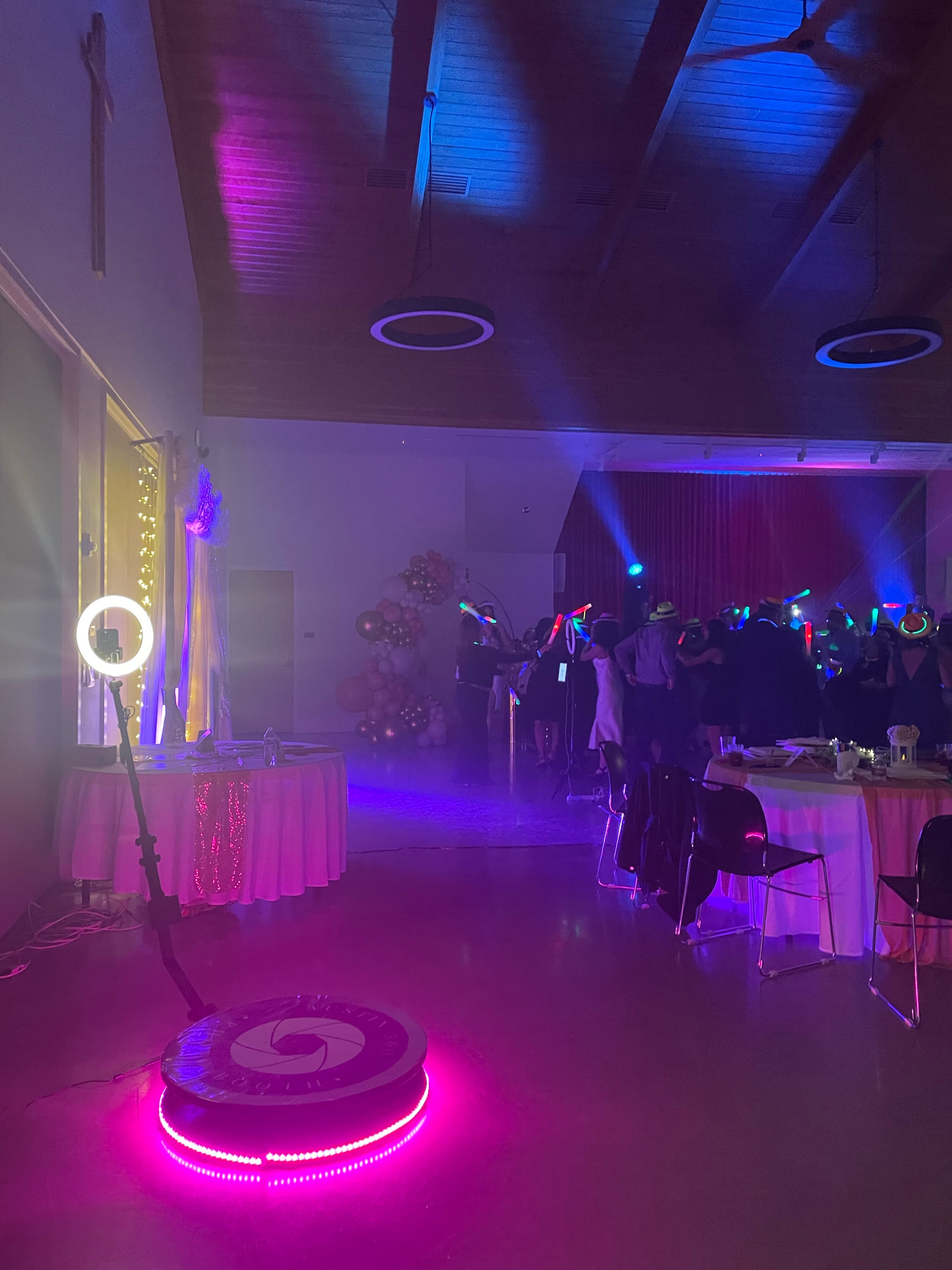 360 photo booth platform glowing purple at an Austin party